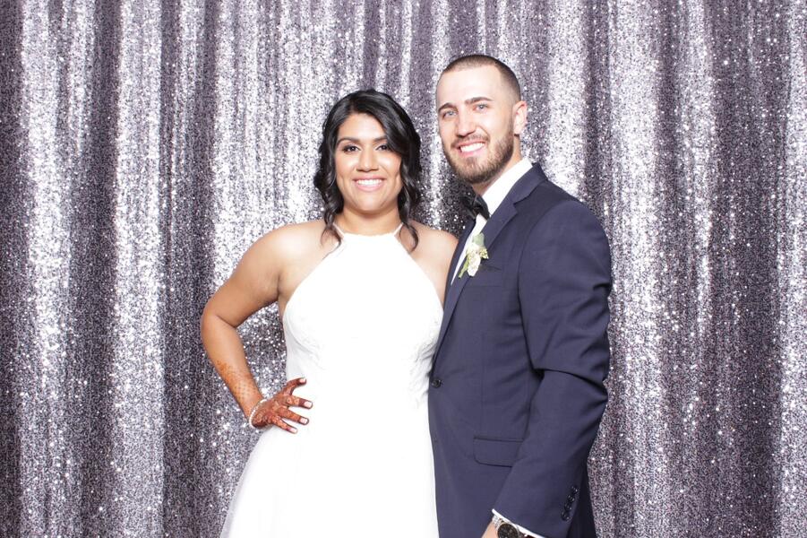 Couple at a silver sequin backdrop
