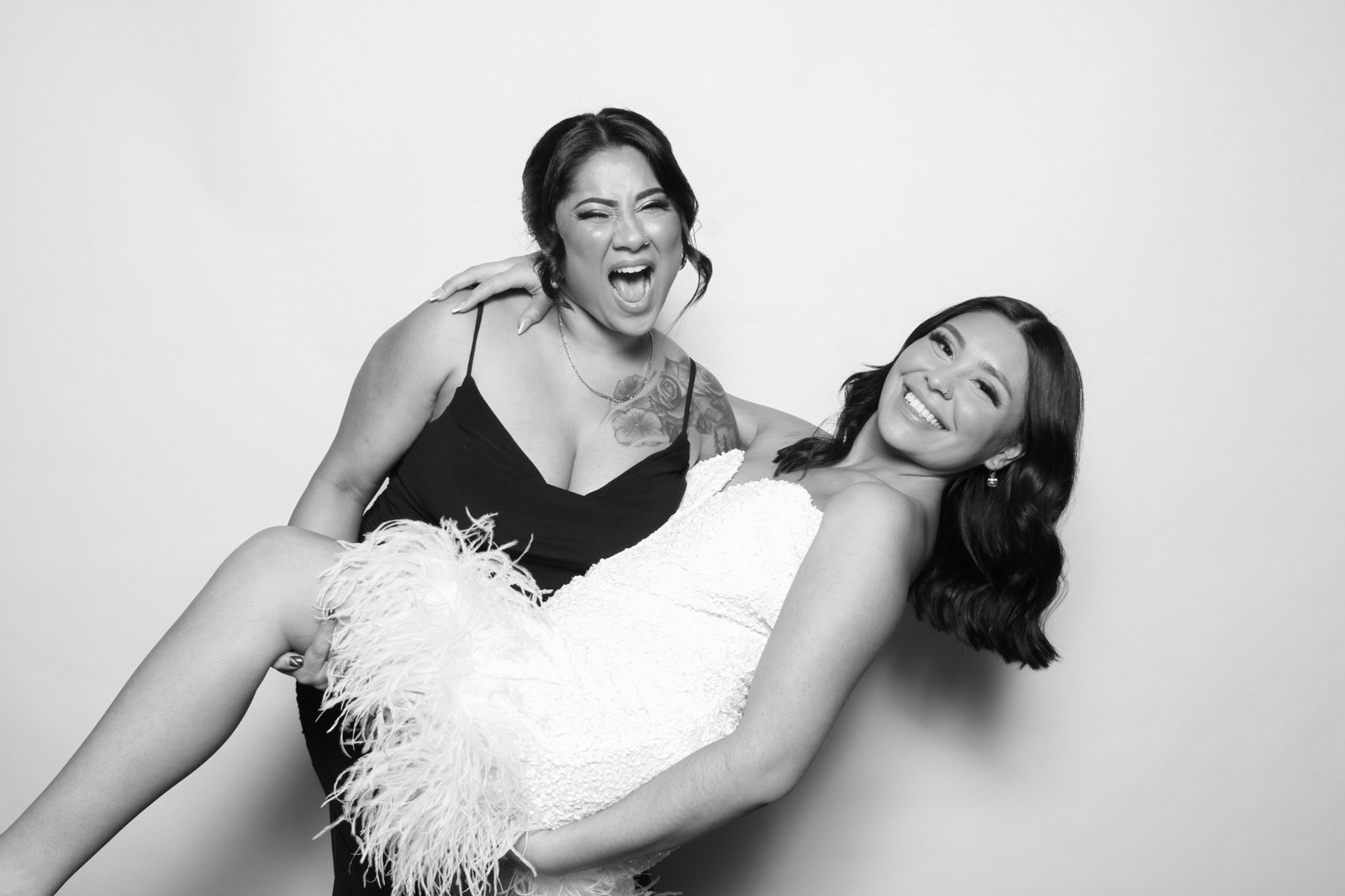 Guests laughing at a wedding photo booth