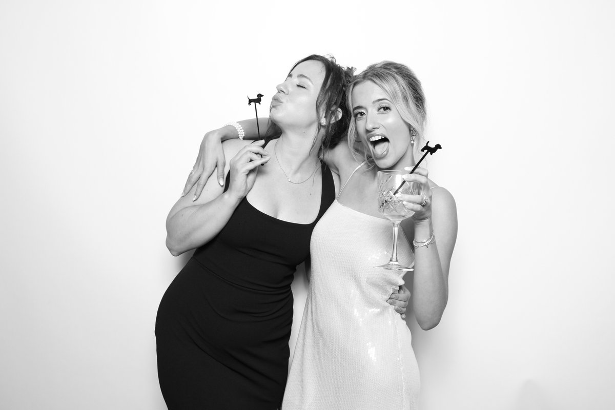 Guests at a wedding photo booth