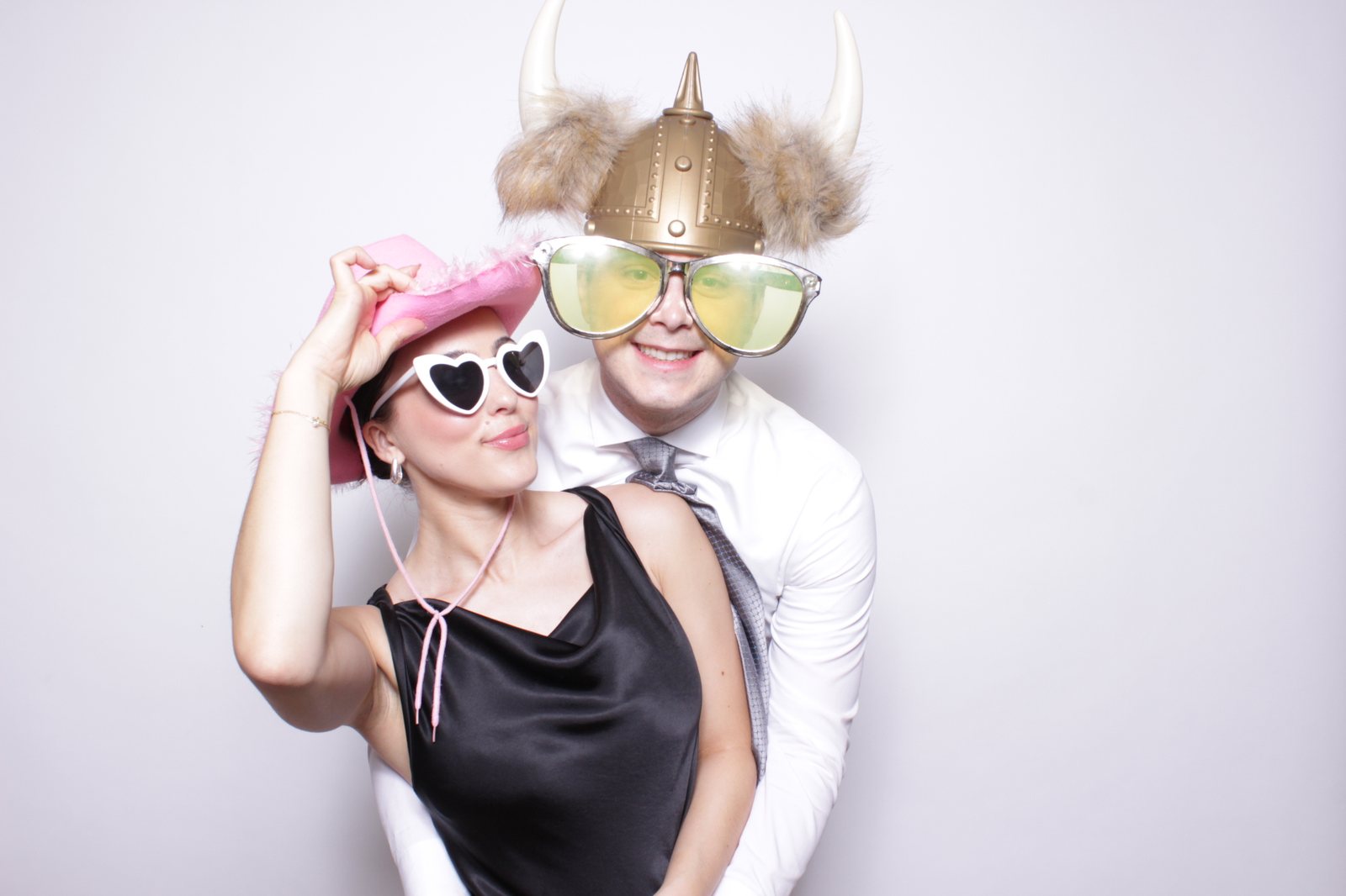 Guests with props at a wedding photo booth