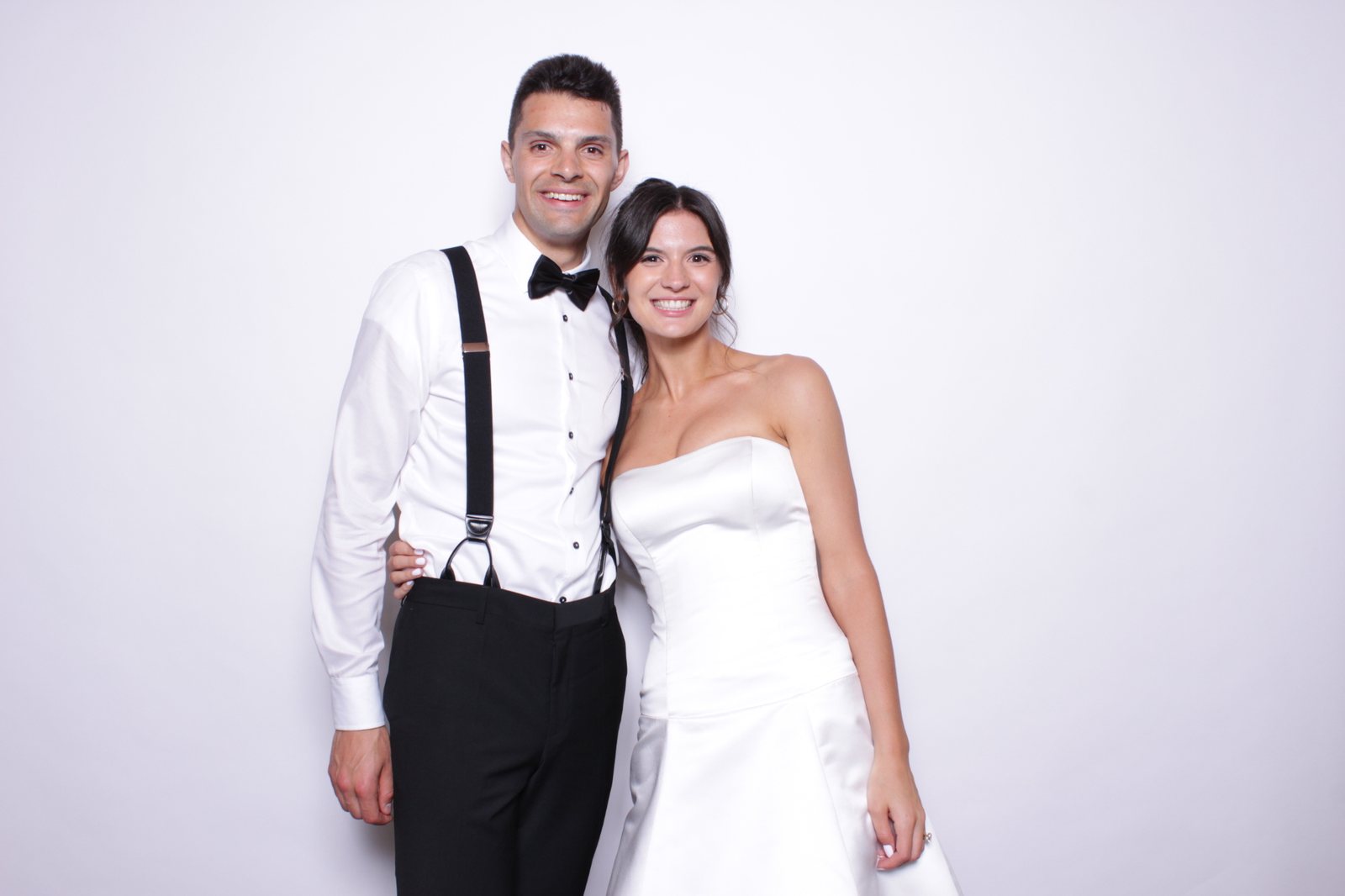 Bride and groom at a wedding photo booth