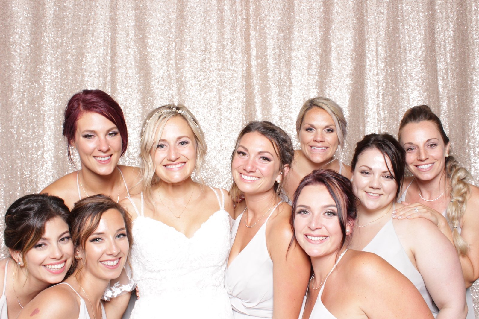 Bridal party at a gold backdrop
