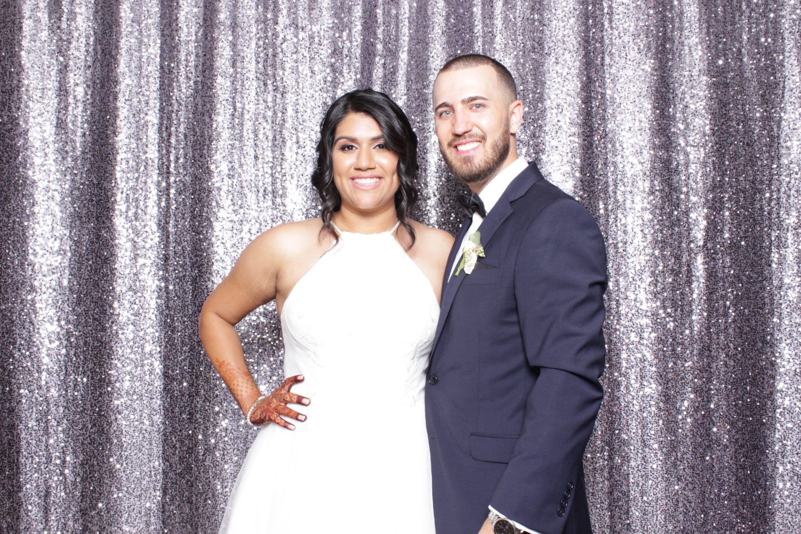 Couple at a silver sequin backdrop